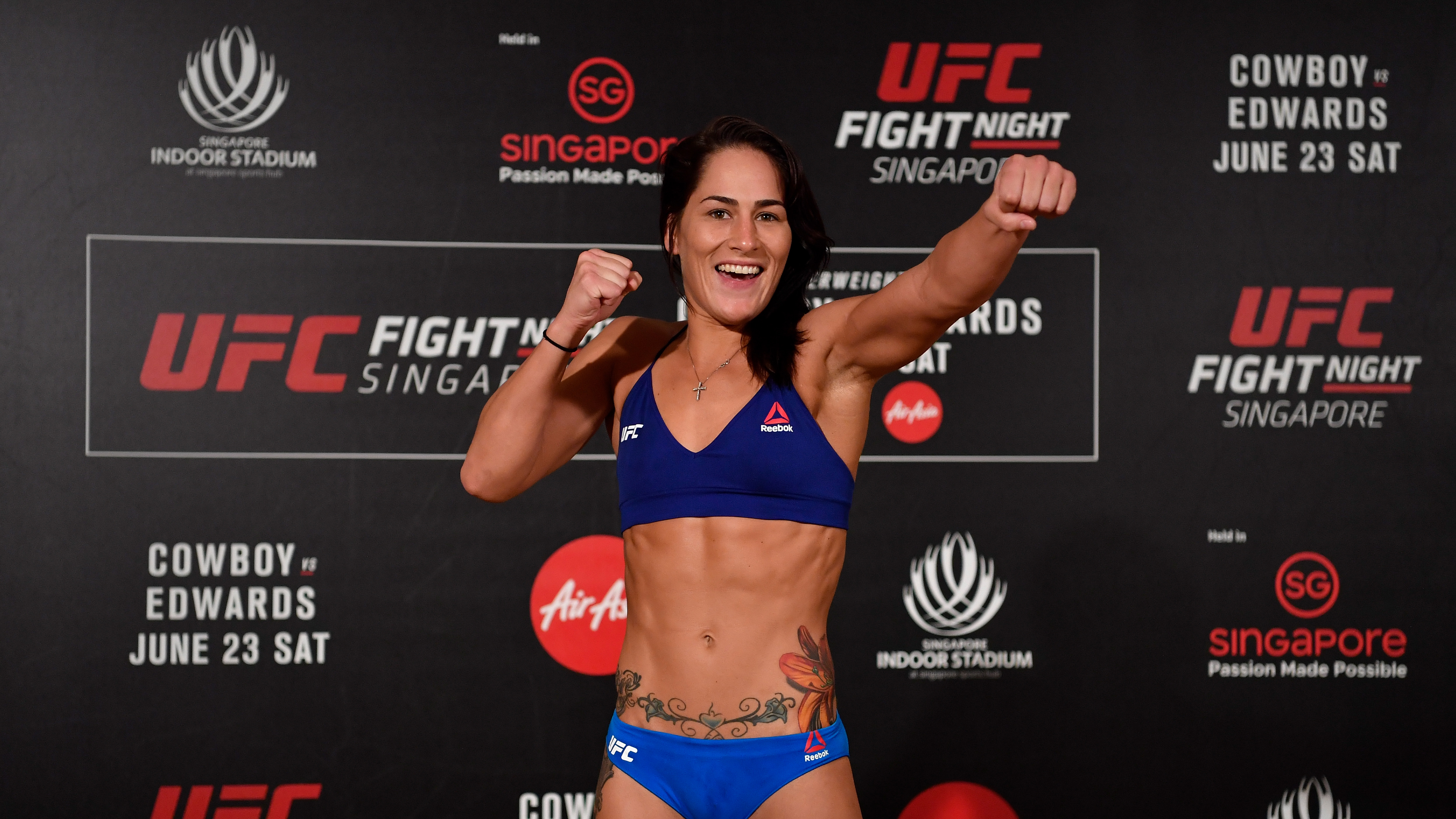 SINGAPORE - JUNE 22: Jessica Eye poses on the scale during the UFC Fight Night weigh-in at the Mandarin Oriental on June 22, 2018 in Singapore. (Photo by Jeff Bottari/Zuffa LLC/Zuffa LLC via Getty Images)